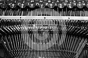 Mechanism of typesetting strikers with the English alphabet in an old retro typewriter photo