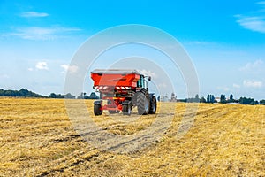Mechanized fertilization with a tractor on the field