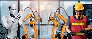 Mechanized industry robot and human worker working together in future factory