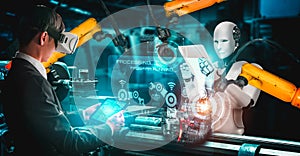 Mechanized industry robot and human worker working together in future factory