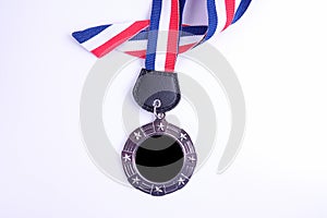 Medal with blue and red ribbon isolated on white