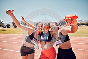 Medal, winner and athlete women at a stadium sports, competition or race success in group hug portrait. Runner people