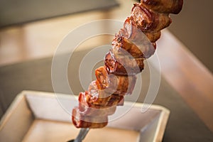 Medallion, pork rolled in bacon served in churrascaria photo