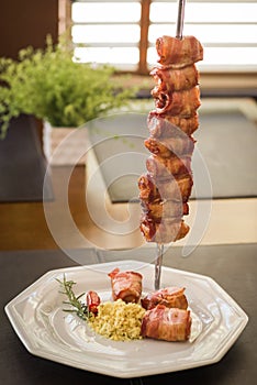 medallion, pork rolled in bacon served in churrascaria. photo