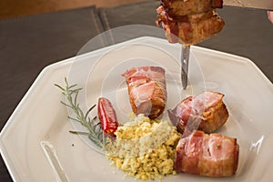 medallion, pork rolled in bacon served in churrascaria. photo