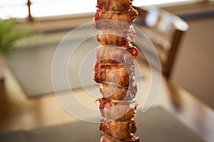 medallion, pork rolled in bacon served in churrascaria. photo