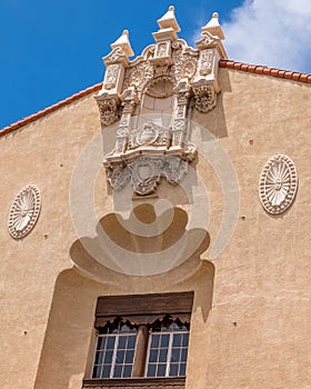 Medallions and carved details on a traditional Spanish style building.