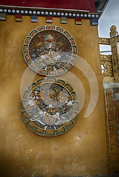 Medallions of carvings of the Guardian Lord deity