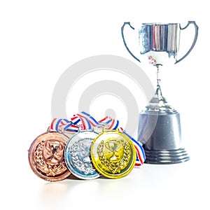 Medals - gold, silver and bronze isolated on white. Reflected