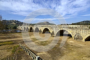 Medellin old bridge and castle from Guadiana, Spain