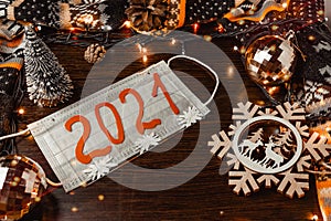 Medi mask with numbers 2021, decorations snowflake deer Christmas decorations, dark background, lights, Christmas background.