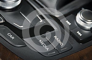 Media control buttons on the dashboard in black leather modern c