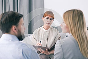Mediator talking to a couple during a session