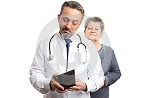 Medic checking wallet with patient looking