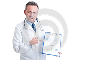 Medic or doctor showing marketing charts