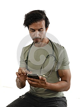 Medic in his 30s, man, using his smartphone during a pause