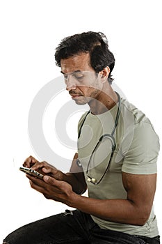 Medic in his 30s, man, using his smartphone during a pause