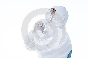 Medic man wearing protective clothing against the virus is pray