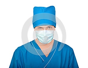 Medic in mask tensely looks in camera