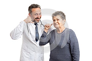 Medic and patient holding fingers as phone concept