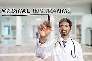 Medic underlining medical insurance text on screen