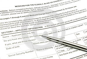 Medicaid Application and Silver Pen photo