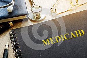 Medicaid. Documents, pen and stethoscope.