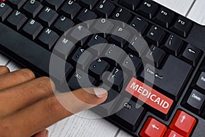 Medicaid isolated on laptop keyboard background