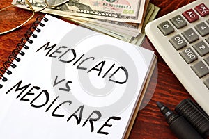 Medicaid vs Medicare written in a note. photo