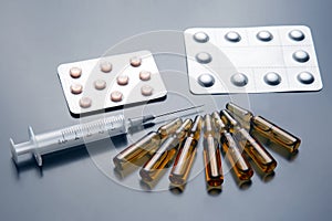 Medical ampoules for injection, tablets and syringe. medicines and disease treatment. pharmacology and science