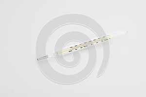 Medical: Analog Thermometer on White Background Shot in Studio.