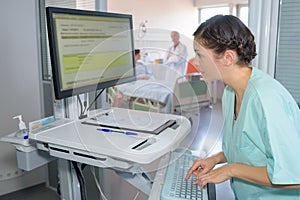 Medical assistant preparing file photo