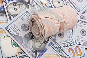 Medical bandage placed US dollar banknotes
