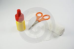 Medical bandages with scissors,  antiseptic and sticking plaster.