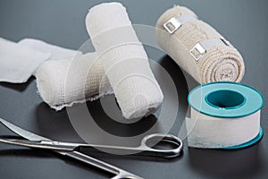 Medical bandages with scissors and sticking plaster
