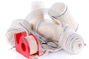 Medical bandages with scissors and sticking plaster