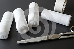 Medical bandages with scissors and sticking plaster.