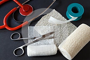 Medical bandages with scissors, sticking plaster