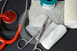 Medical bandages with scissors, sticking plaster