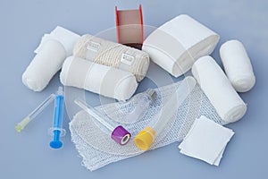 Medical bandages with sticking plaster and syringes