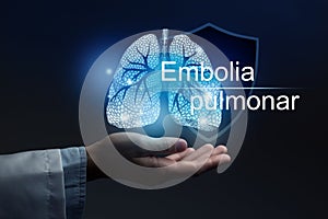 Medical banner Pulmonary Embolism with spanish translation Embolia pulmonar on blue background with large copy space photo