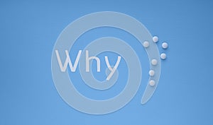 Medical banner with word `Why` and white pills in the form of a question mark on a blue background with copy space for text