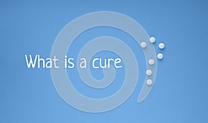 Medical banner with words `What is a cure` and white pills in the form of a question mark on a blue background with copy space for