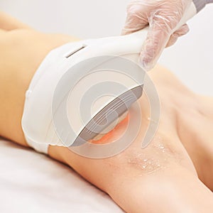 Medical beauty laser cosmeology procedure. Young female at salon. Professional doctor. Woman skincare technology. Hair removal