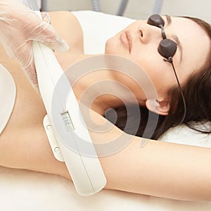 Medical beauty laser cosmeology procedure. Young female at salon. Professional doctor. Woman skincare technology. Hair removal