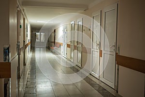 Medical bed, wheelchair, in the corridor of the hospital inpatient department