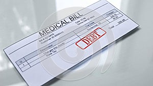 Medical bill debt, seal stamped on document, payment for services, tariff