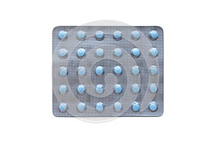 Medical blister packs with little blue pills isolated on white