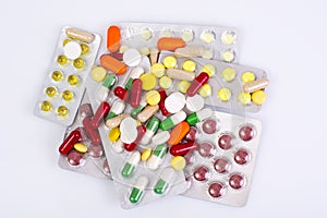 Medical bottles and foil blisters with the capsules and tablets