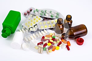 Medical bottles and foil blisters with the capsules and tablets